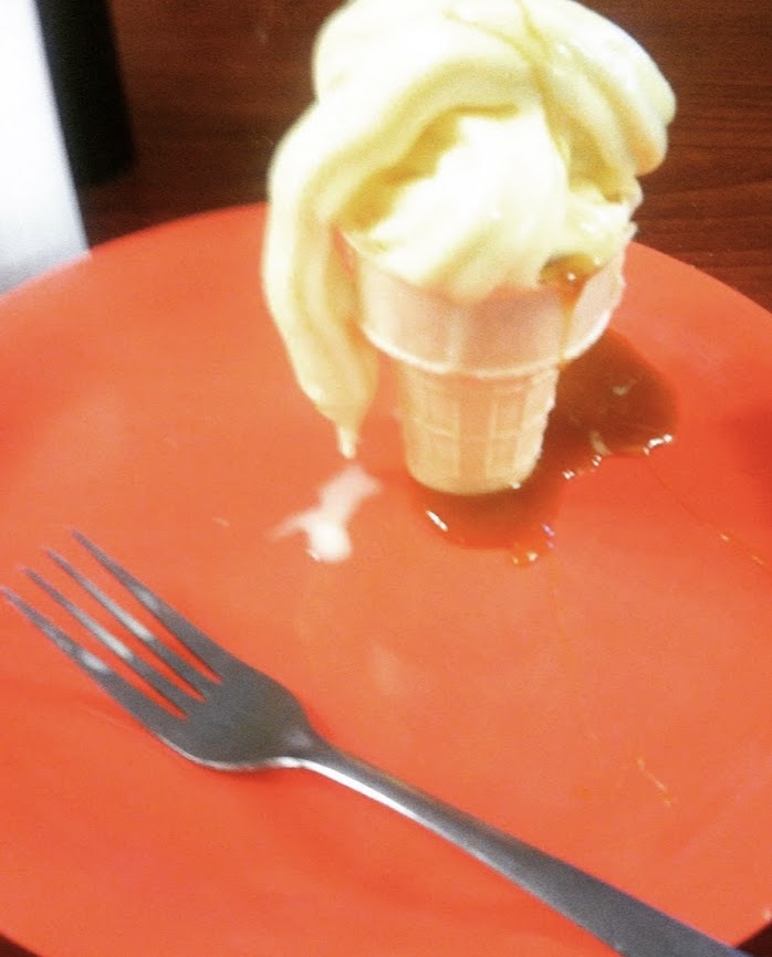 ice cream cone next to a fork